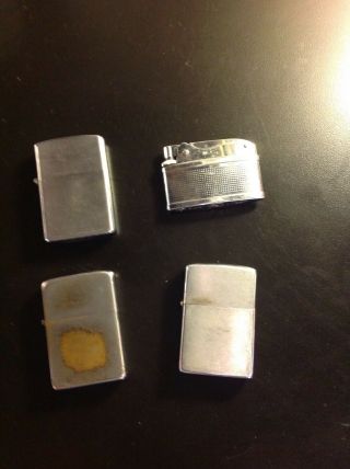 Four (4) Cigarette Lighters - 2 Zippo,  Hadson,  Nesor